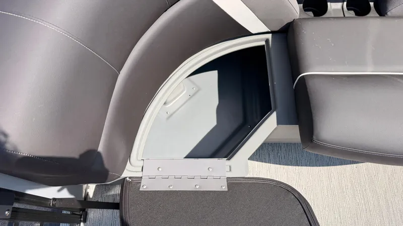 Slide: The Image of A seating area with an open storage compartment underneath, in a modern boat. - 18