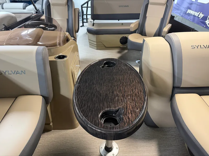 Slide: The Image of Interior view of a Sylvan MIRAGE X1 CLZ DH with beige and gray seating and an oval table. - 8