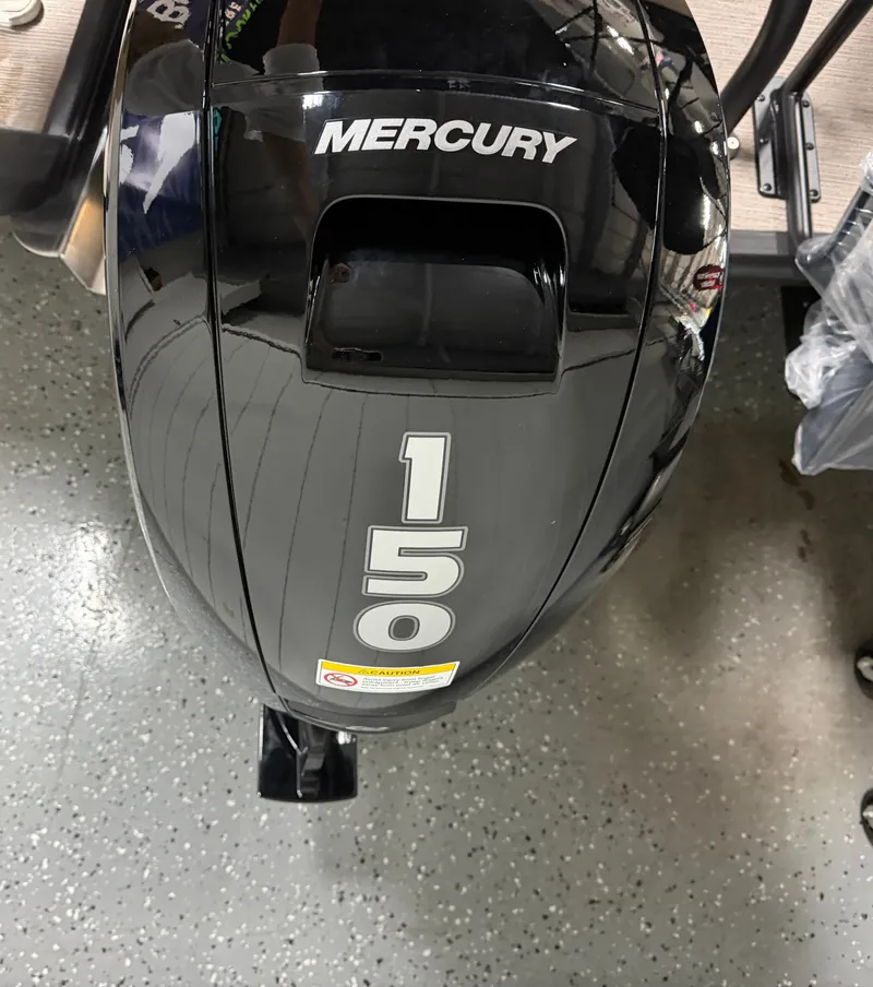 Slide: The Image of A Mercury 150 outboard motor is mounted on a boat. - 21