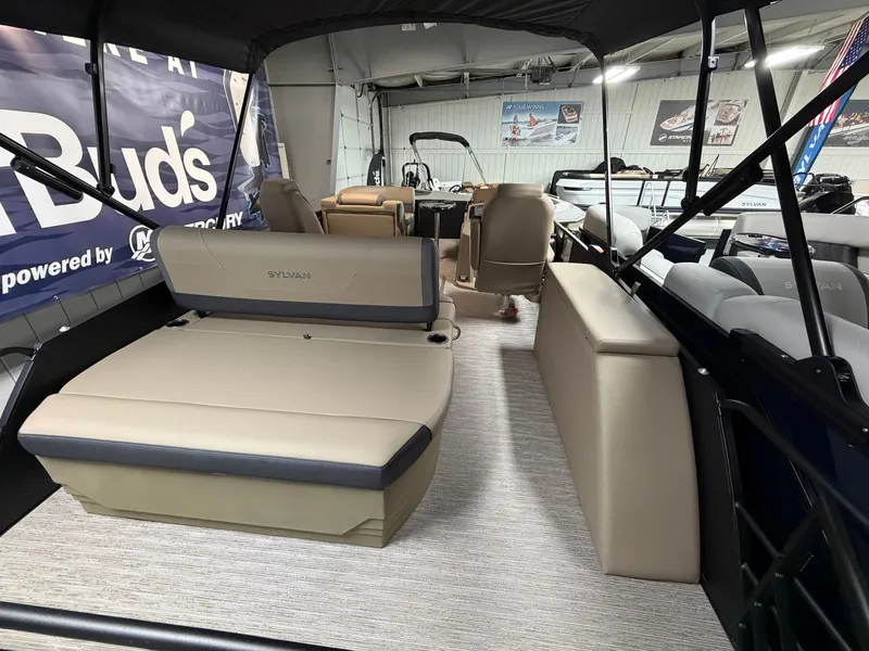 Slide: The Image of Interior of a 2026 Sylvan MIRAGE X1 CLZ DH with beige seating and carpeted floor. - 19
