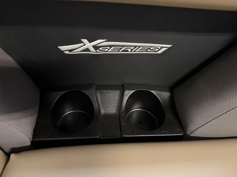 Slide: The Image of Sylvan MIRAGE X1 CLZ DH 2026: Cup holders and "X Series" logo in the interior. - 4
