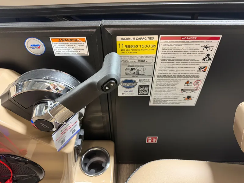 Slide: The Image of Close-up of the throttle and safety stickers on a Sylvan MIRAGE X1 CLZ DH boat. - 17