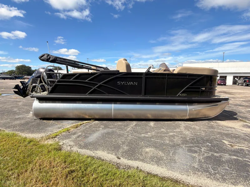 Slide: The Image of Sylvan Mirage 8520 CLZ DH 2027 on a parking lot with blue sky. - 6
