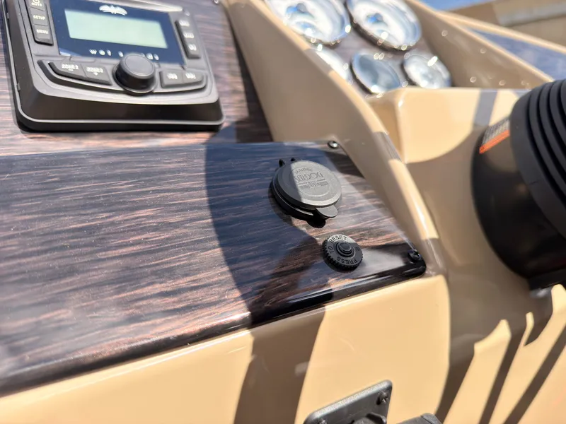 Slide: The Image of Close-up of a 2027 Sylvan Mirage 8520 CLZ DH dashboard with wood paneling and instruments. - 45