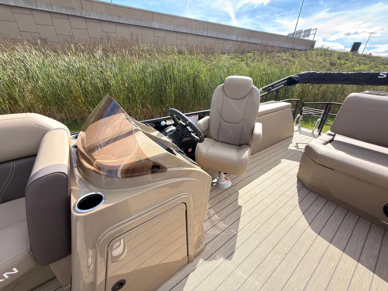Slide: The Image of The image shows the cockpit of a 2027 Sylvan Mirage 8520 CLZ DH with beige seating. - 36