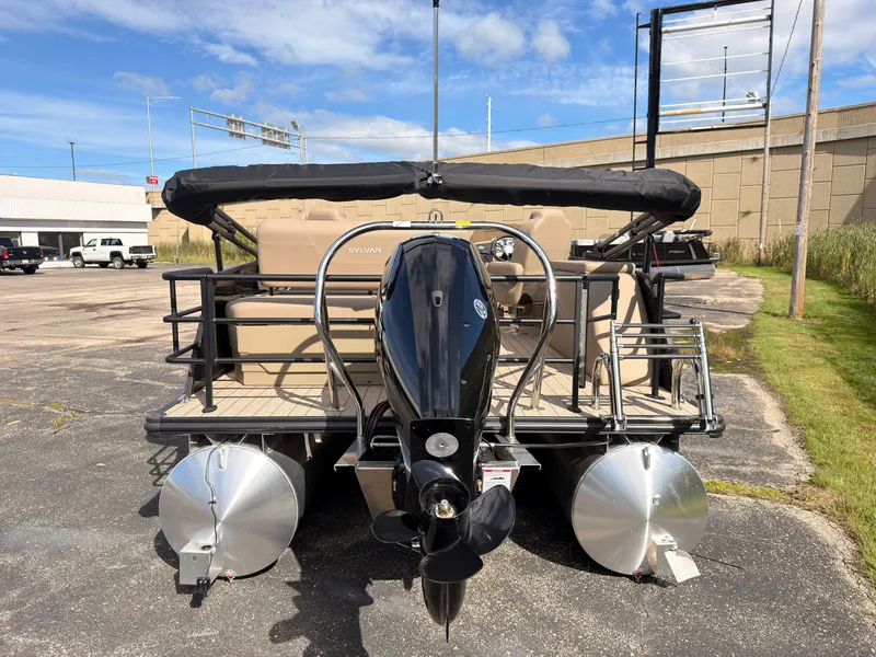Slide: The Image of The image shows a 2027 Sylvan Mirage 8520 CLZ DH pontoon boat with an outboard motor. - 4