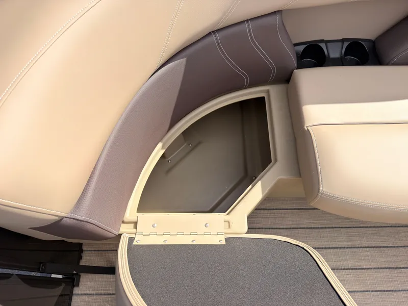 Slide: The Image of Seating area with storage compartment and cup holders on a 2027 Sylvan Mirage 8520 CLZ DH. - 23