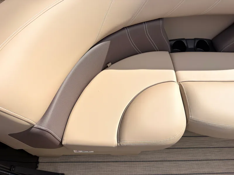 Slide: The Image of Beige and gray upholstery on a boat seat with cup holders. - 21