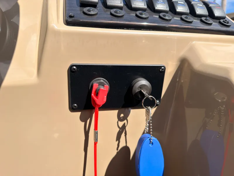 Slide: The Image of Close-up of a boat control panel with keys and switches. - 43