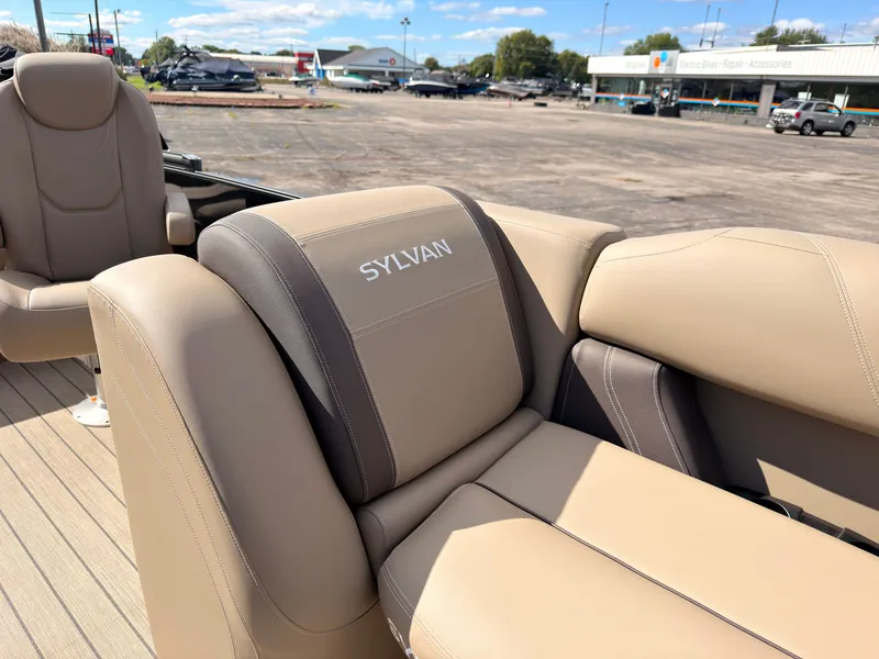 Slide: The Image of Sylvan Mirage 8520 CLZ DH 2027: Beige outdoor seating with Sylvan branding. - 17