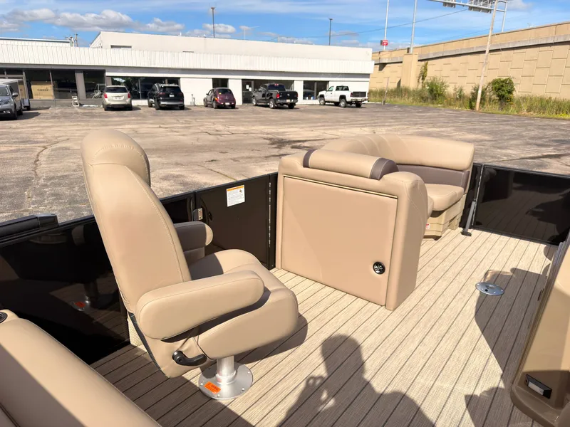 Slide: The Image of The image shows the deck of a 2027 Sylvan Mirage 8520 CLZ DH with beige seating. - 31