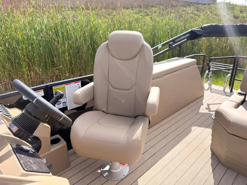Slide: The Image of Sylvan Mirage 8520 CLZ DH 2027: Beige captain's chair on a boat with wood decking. - 37