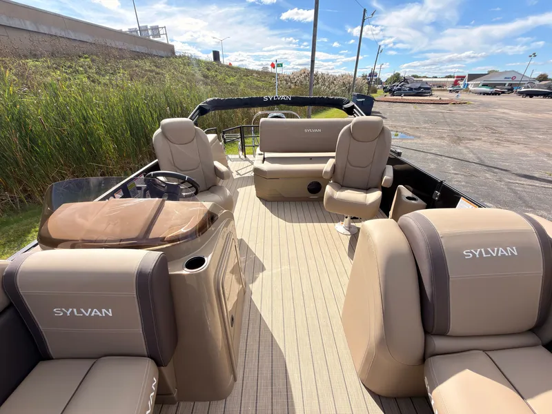 Slide: The Image of The image shows the interior of a 2027 Sylvan Mirage 8520 CLZ DH. It features beige upholstery and a modern design. - 26