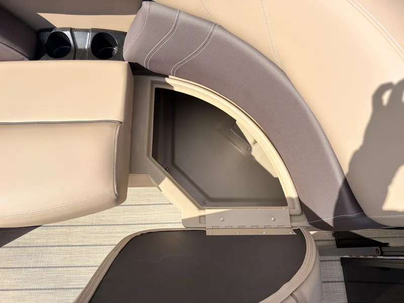 Slide: The Image of Close-up of a seating area with storage and cup holders on a boat. - 14