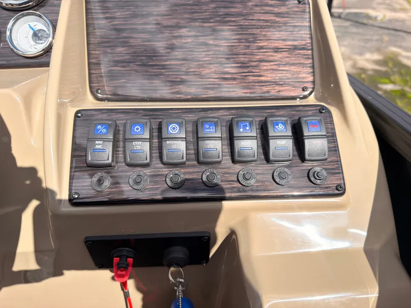 Slide: The Image of The dashboard of a 2027 Sylvan Mirage 8520 CLZ DH with various switches and gauges. - 42