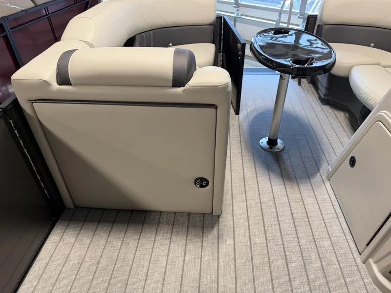 Slide: The Image of The image shows the interior of a 2027 Sylvan Mirage 8520 CLZ DH with sleek seating and a small table. - 15