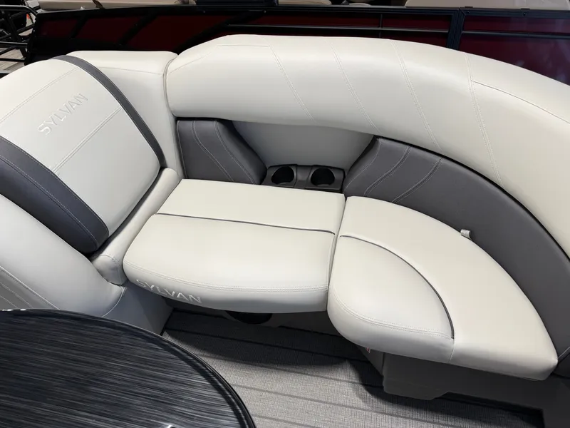 Slide: The Image of Sylvan Mirage 8520 CLZ DH 2027: Luxurious white and gray seating with cup holders. - 6
