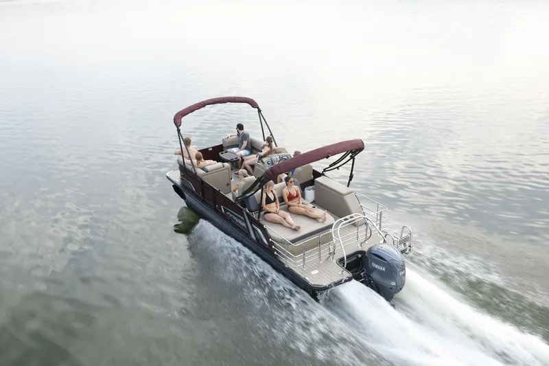 Slide: The Image of Starcraft EXS 1 Q DH 2026: Pontoon boat with sunshade, cruising on calm water. - 1