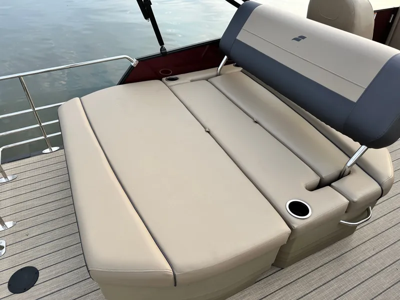 Slide: The Image of The image shows a beige lounging area on a boat with cup holders. - 4