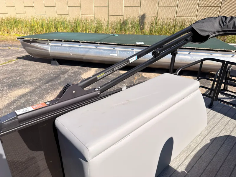 Slide: The Image of The image shows part of a 2027 Starcraft EXS 1 Q DH boat with a gray seat. - 42