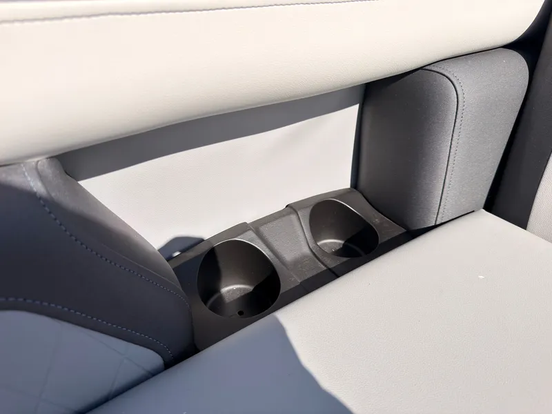 Slide: The Image of Close-up of two cup holders in a gray boat seat. - 18