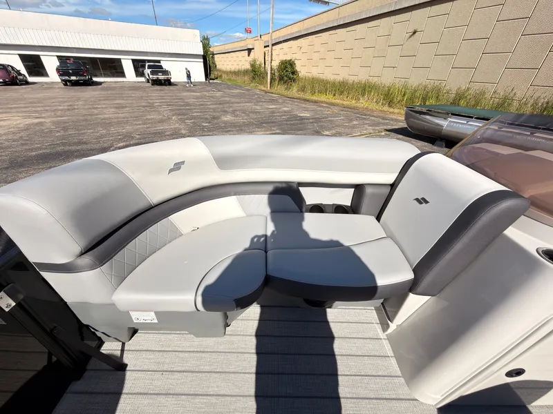 Slide: The Image of The image shows a modern boat seating area with gray upholstery and sleek design. - 15