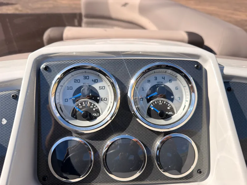 Slide: The Image of Close-up of a boat instrument panel with speed and RPM gauges. - 33