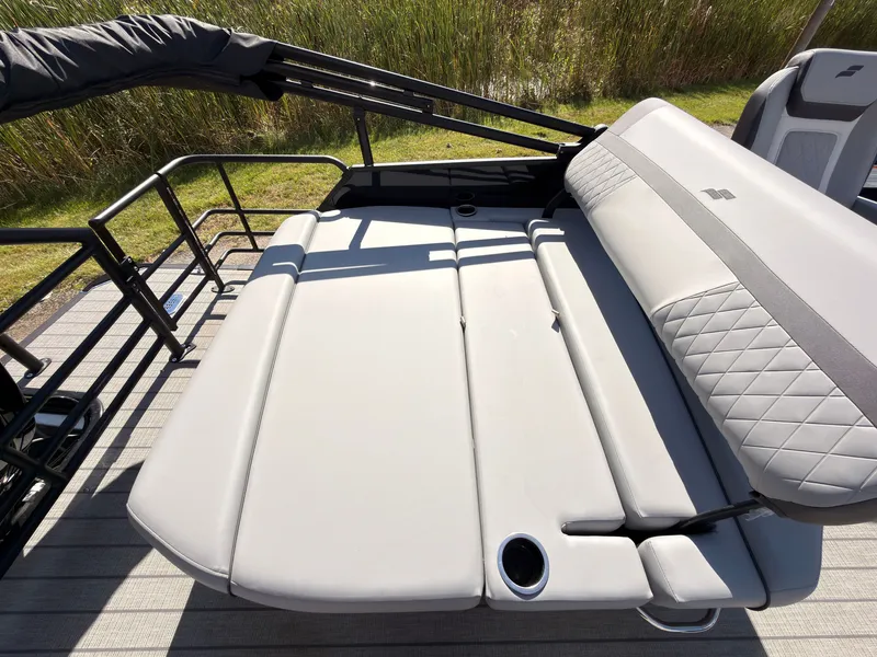 Slide: The Image of The image shows the lounge seating of a 2027 Starcraft EXS 1 Q DH with gray upholstery. - 45