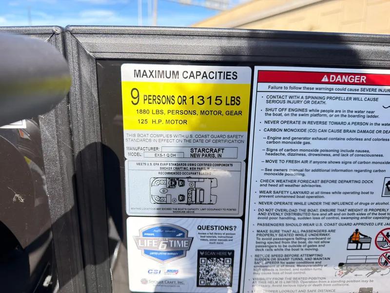Slide: The Image of A sign displays the boat's maximum capacity: 9 persons or 1315 pounds. - 38