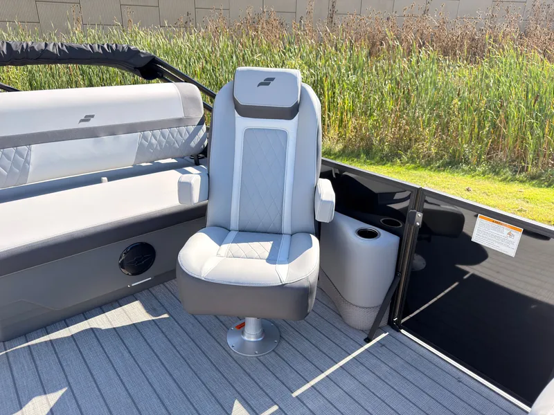Slide: The Image of A modern boat seat with gray upholstery and armrests on a 2027 Starcraft EXS 1 Q DH. - 23