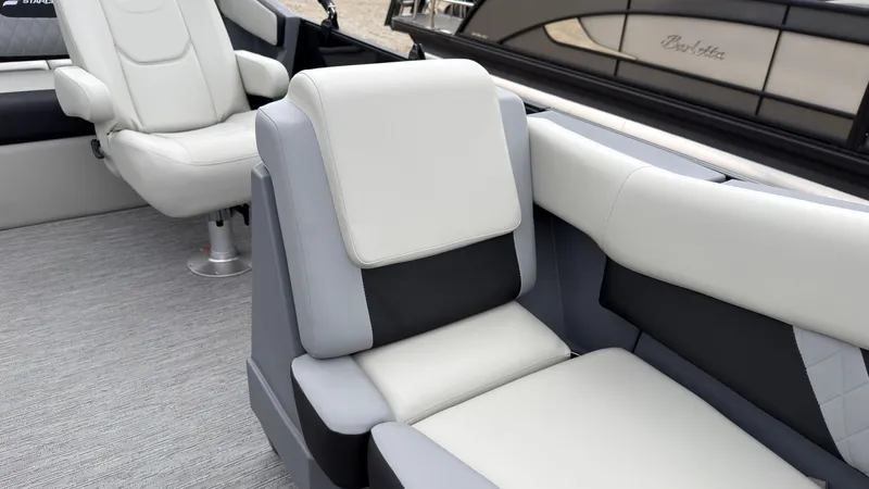 Slide: The Image of The image shows luxurious, cushioned seating on a modern boat with gray flooring. - 26