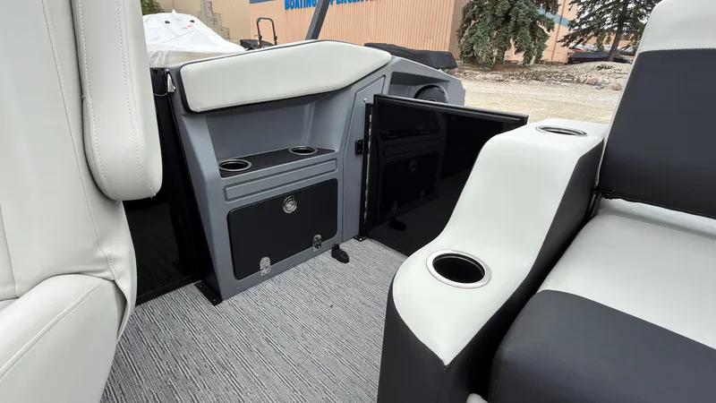 Slide: The Image of The image shows the interior of a 2027 Starcraft VX 20 Q DH with gray and black seating. - 45