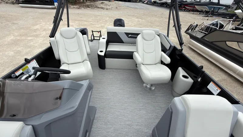 Slide: The Image of The image shows the interior of a 2027 Starcraft VX 20 Q DH boat with white seating. - 28