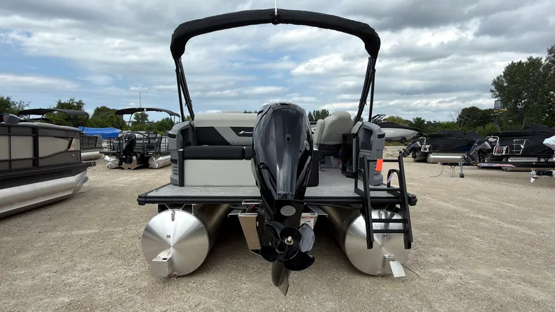 Slide: The Image of The image shows a 2027 Starcraft VX 20 Q DH pontoon boat with an outboard motor. - 5
