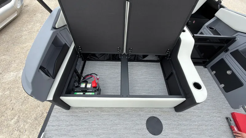 Slide: The Image of The image shows storage space under a seat on a Starcraft VX 20 Q DH boat. - 49
