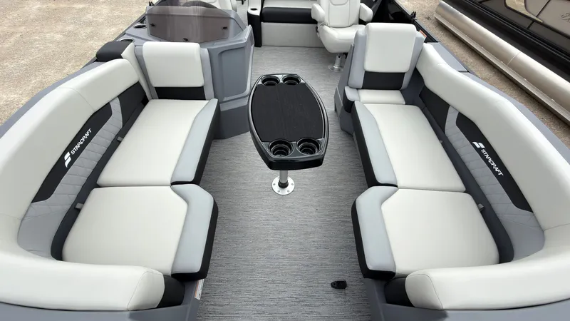 Slide: The Image of Interior of a 2027 Starcraft VX 20 Q DH with gray and white seating and a table. - 14