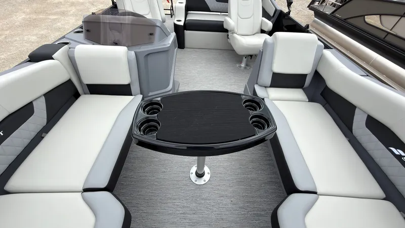 Slide: The Image of The image shows the interior of a 2027 Starcraft VX 20 Q DH with sleek seating and a table. - 27