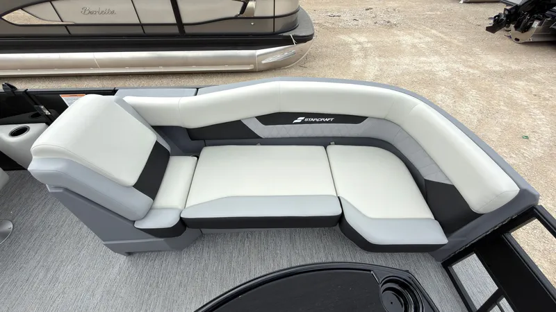 Slide: The Image of The image shows a luxurious seating area on a 2027 Starcraft VX 20 Q DH boat. - 21