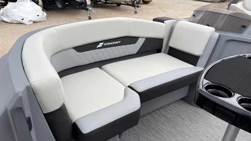 Slide: The Image of The image shows a gray and white bench seat on a boat with the Starcraft logo. - 15