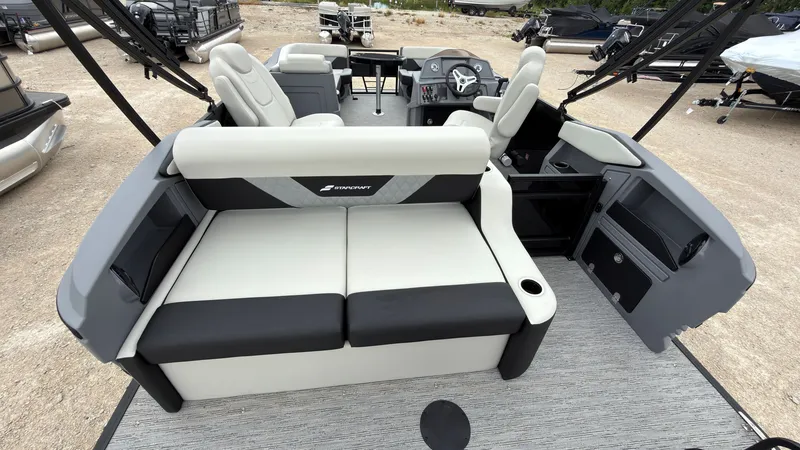 Slide: The Image of The image shows the interior of a 2027 Starcraft VX 20 Q DH with modern seating and helm. - 48