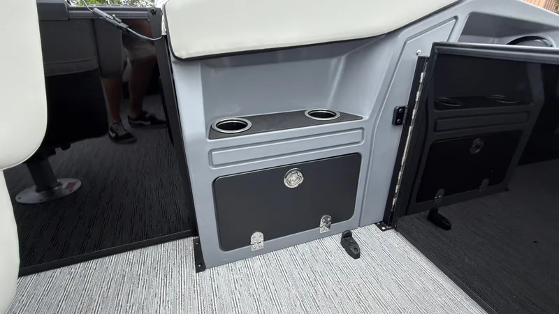 Slide: The Image of Interior of a 2027 Starcraft VX 20 Q DH with cup holders and storage compartment. - 46