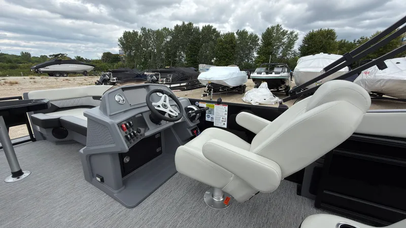 Slide: The Image of The image shows the cockpit of a 2027 Starcraft VX 20 Q DH with gray seats and dashboard. - 31