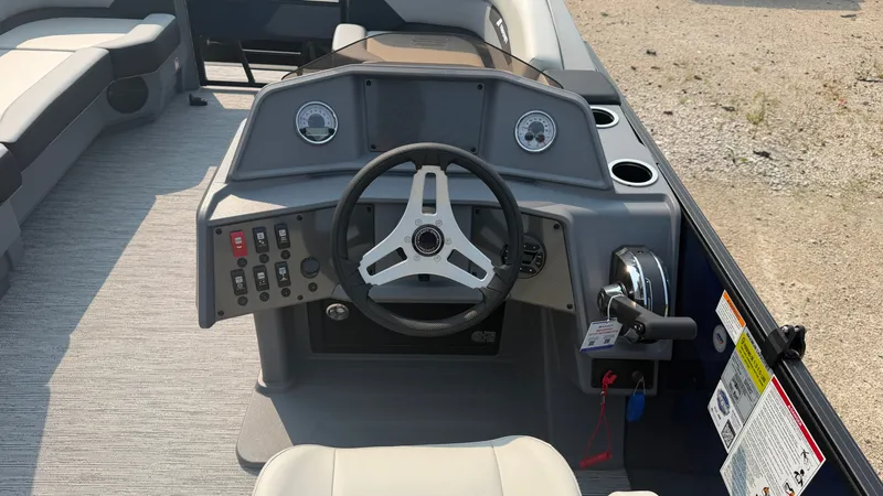 Slide: The Image of Helm of a 2027 Starcraft VX 20 R DH with modern steering wheel and instruments. - 25