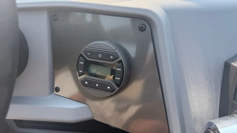 Slide: The Image of Close-up of a modern boat control panel featuring a round control interface. - 30