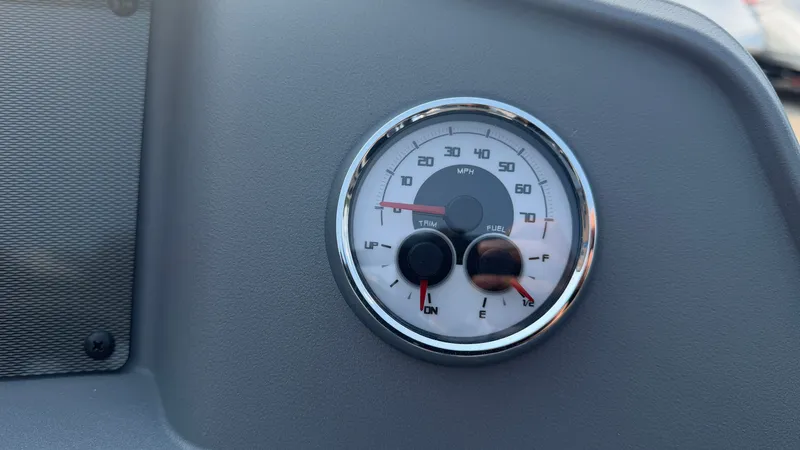 Slide: The Image of Close-up of a speedometer and fuel gauge on a boat. - 28