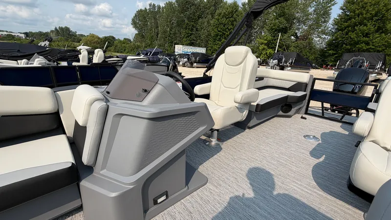 Slide: The Image of The image shows the interior of a 2027 Starcraft VX 20 R DH with beige seating. - 23