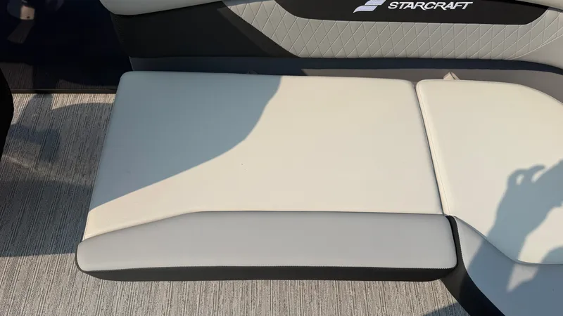Slide: The Image of The 2027 Starcraft VX 20 R DH seat features a modern design with gray and white upholstery. - 40