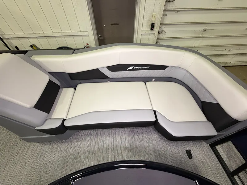 Slide: The Image of The 2027 Starcraft VX 20 Q DH features a sleek, cushioned seating area with a modern design. - 11