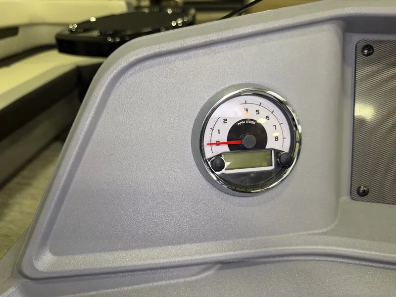 Slide: The Image of Close-up of a tachometer on a gray dashboard of a Starcraft VX 20 Q DH boat. - 17