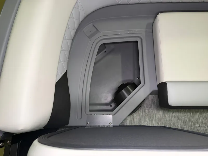 Slide: The Image of The image shows a gray and white seating area with a built-in storage compartment. - 8